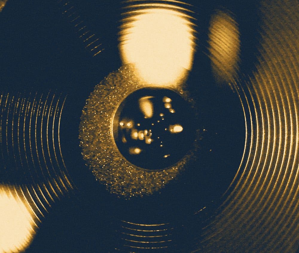 A camera lens up close, with reflections of light